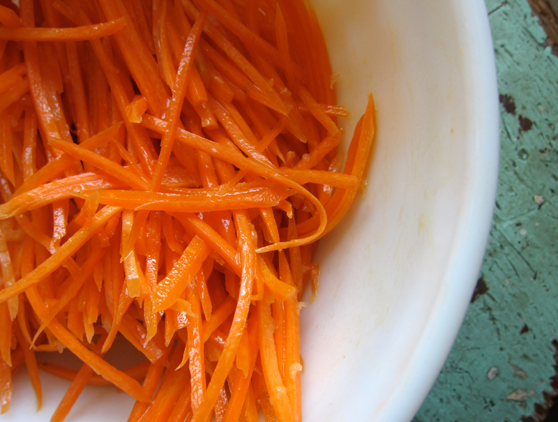 Photo of a bowl of shredded carrots