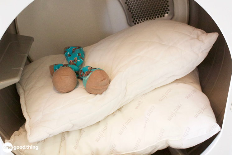 Once you've got your yellow pillows clean and white, dry them in the dryer with dryer balls to keep them fluffy.