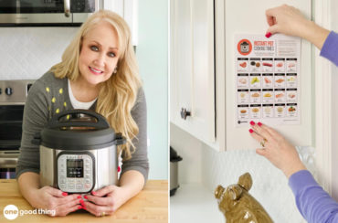 A woman with an Instant Pot and an instant pot cooking times cheat sheet.