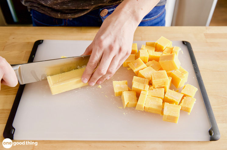 The Fels-Naptha soap needs to be in very fine pieces for homemade laundry detergent, so start by cutting the bars into small cubes.