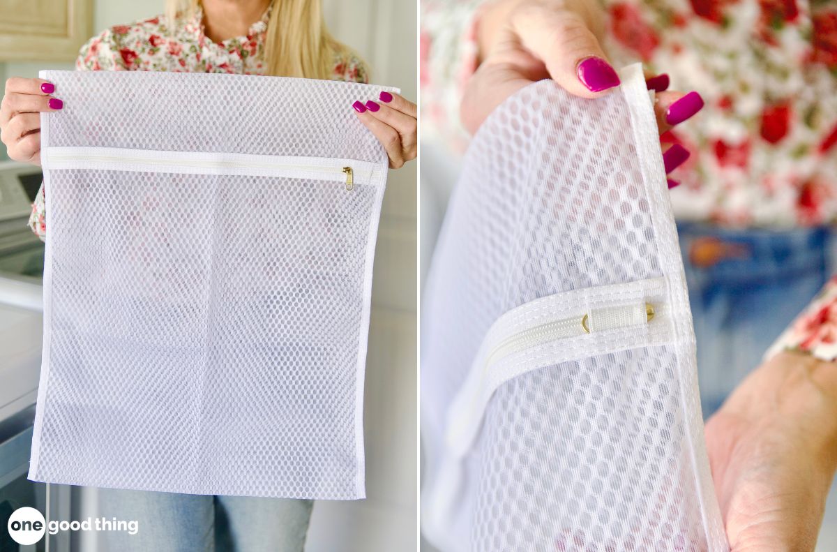 A woman holding a large mesh laundry bag with a recessed zipper tab to protect clothing.