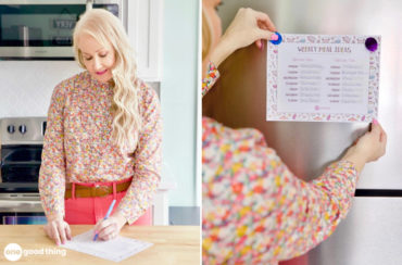 woman writing on a weekly meal plan printable and hanging it on the fridge