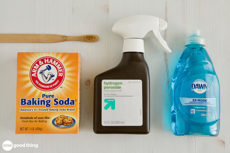 My best method for getting oil stains out of clothing uses baking soda, hydrogen peroxide, and Dawn dish soap.