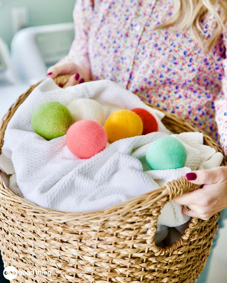 Solving Laundry Problems - dryer balls on a basket of clean towels