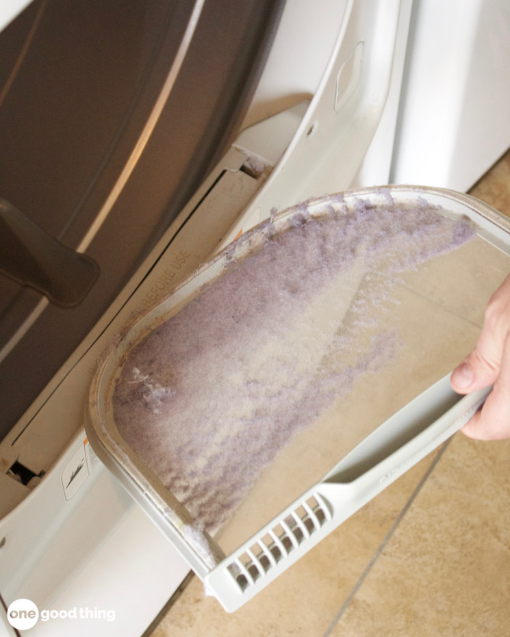 Solving Laundry Problems - pulling a dirty lint filter from a dryer