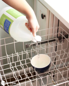 Start cleaning your dishwasher by using a cup of white vinegar with the hottest wash cycle.