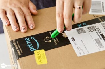 Using a box cutter to open an Amazon box.