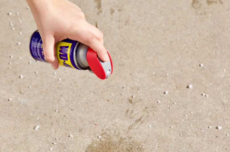 Uses for WD-40 - spraying on a stain on concrete