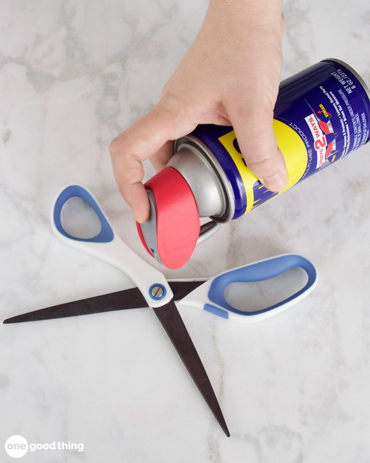 Uses for WD-40 - spraying on scissors