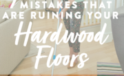 A woman meticulously mopping the hardwood floors.