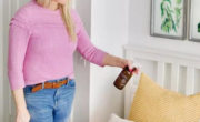 A woman arranging scented pillows to make her house smell good.