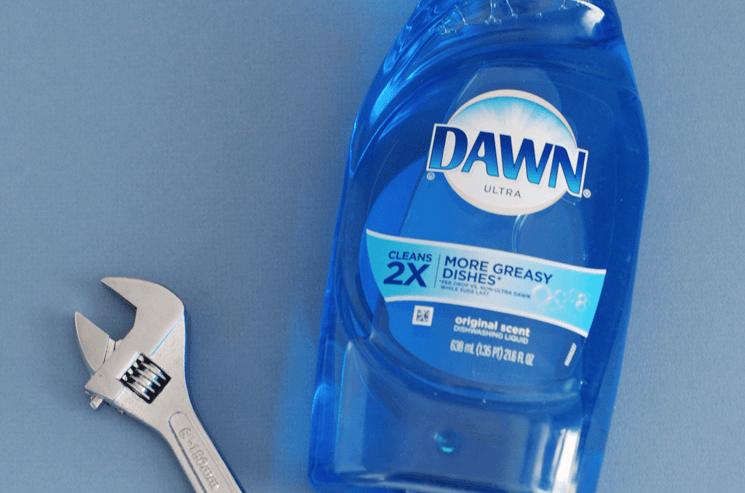 blue dawn dish soap and a wrench