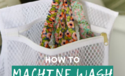 A person places a colorful garment into a white laundry bag emblazoned with the text "how to hand wash your 'machine wash only' clothing.